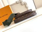 Louis Vuitton monogram pouch bag with green web strap and zipper closure