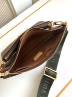 Louis Vuitton monogram zip crossbody bag open view with leather tab inside
