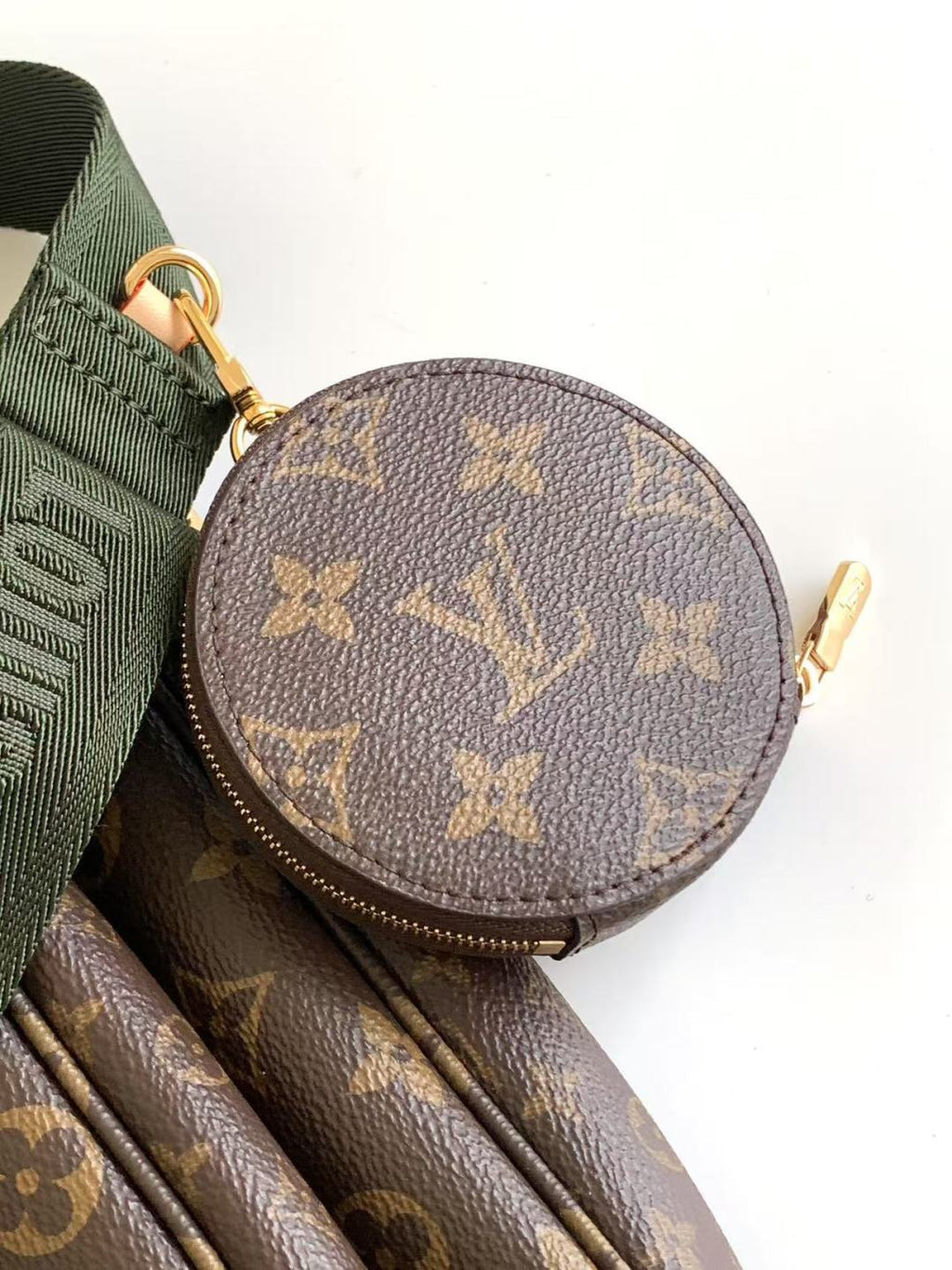 Louis Vuitton monogram round coin pouch with zipper and green strap loop