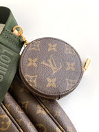Louis Vuitton monogram round coin pouch with zipper and green strap loop