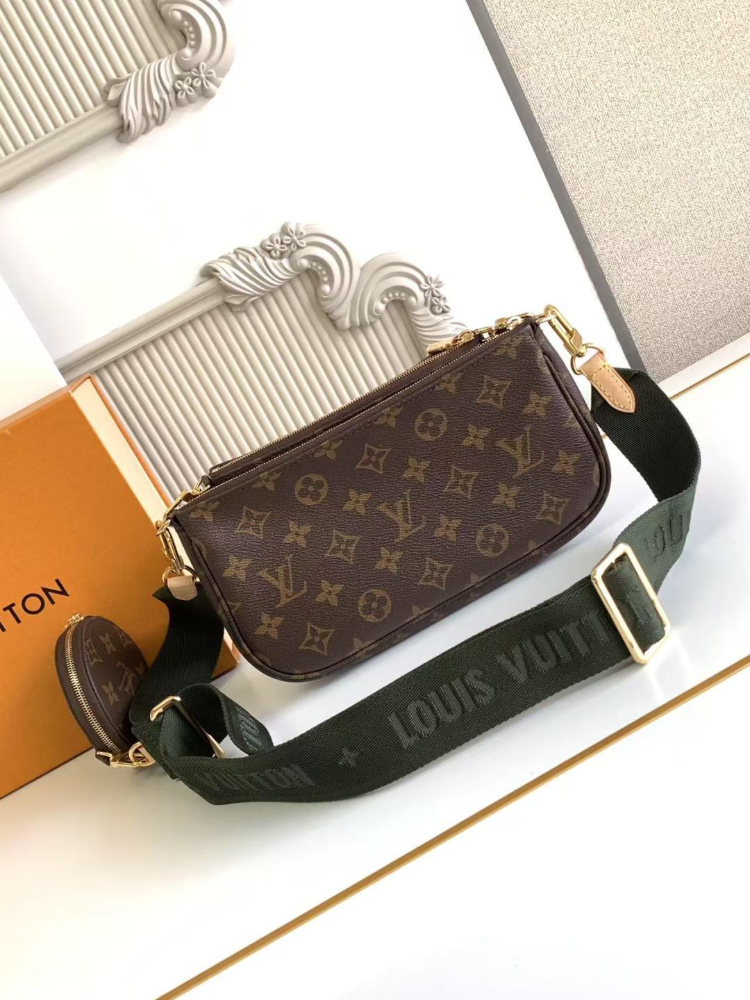 Louis Vuitton monogram crossbody bag with adjustable green web strap and gold trim