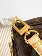 Louis Vuitton monogram bag with gold hardware ring and green web strap