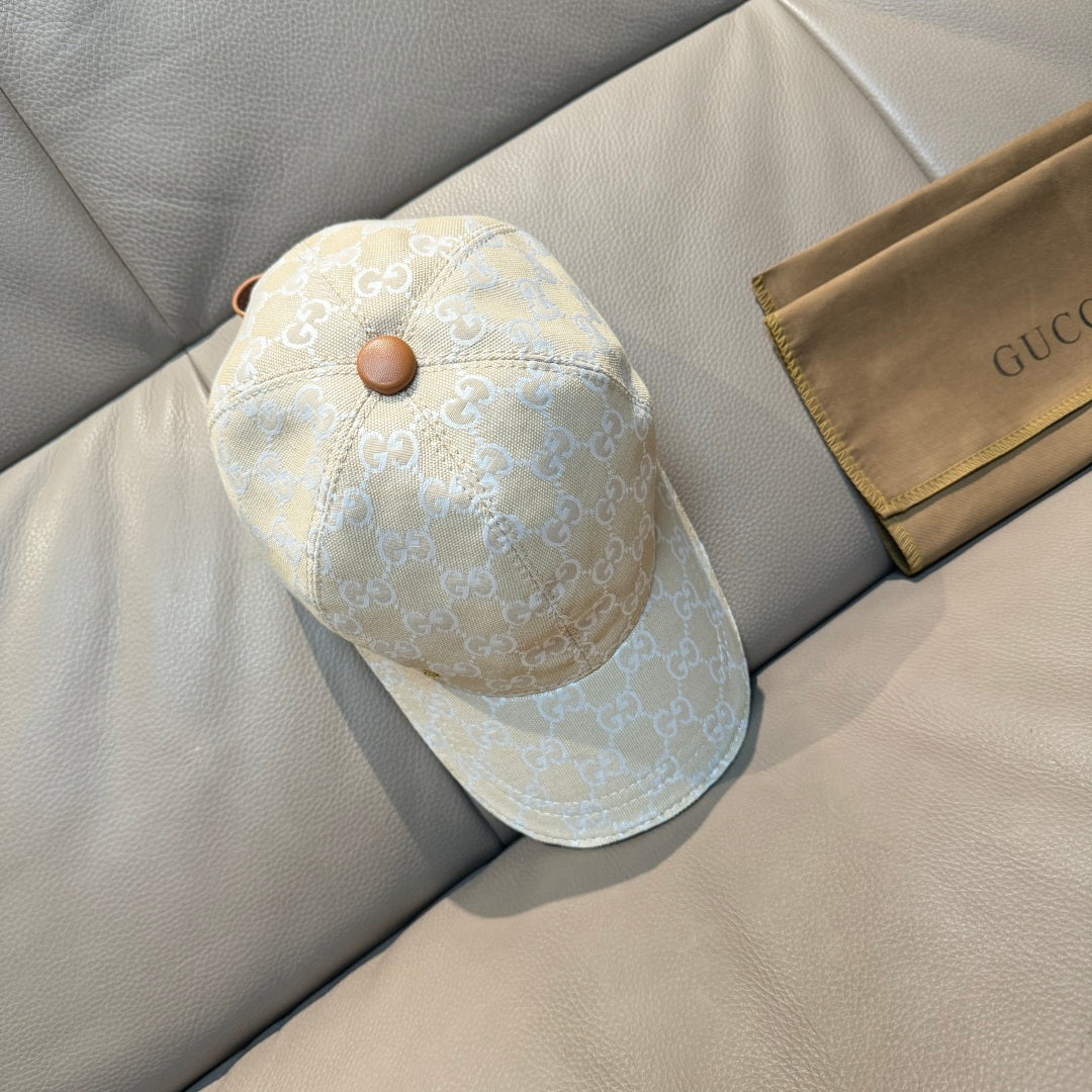 Gucci cap with light blue-gray GG monogram fabric and curved brim front.