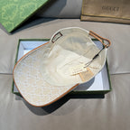 Gucci baseball cap with beige GG monogram fabric, interior view with tan lining.