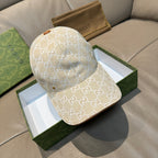 Gucci baseball cap with beige GG monogram canvas, curved brim.