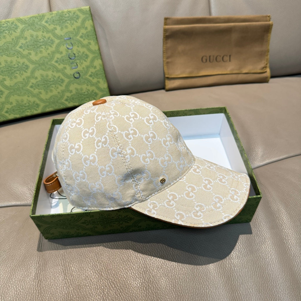 Gucci baseball cap with beige GG monogram fabric and tan-edged brim.