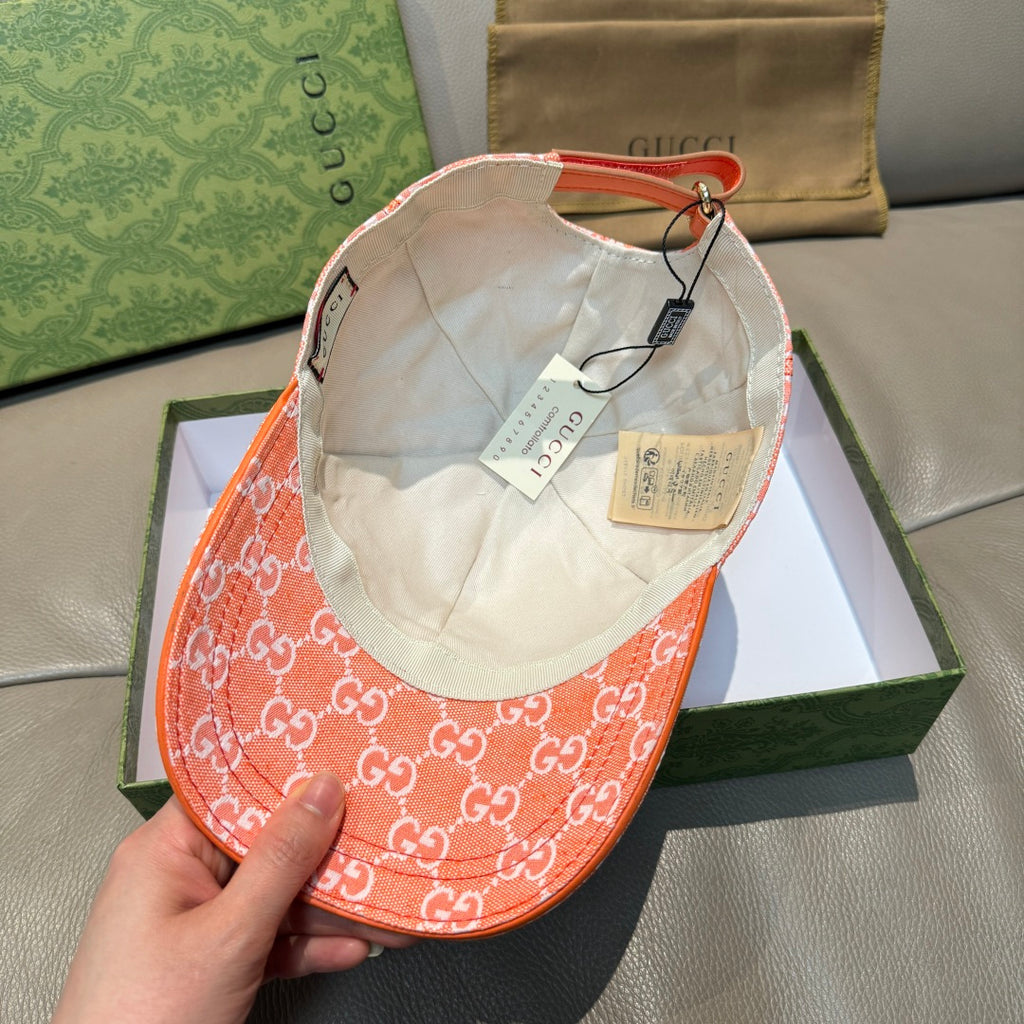 Orange GG monogram baseball cap interior with beige lining and size tag