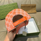 Orange GG monogram baseball cap with adjustable strap on the side