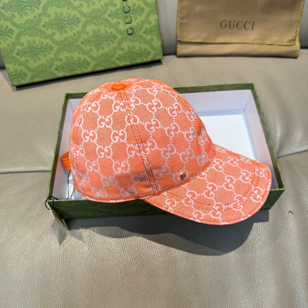 Orange GG monogram baseball cap with curved brim and crown panel stitching