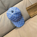 Gucci GG canvas baseball cap in blue with button front and curved brim
