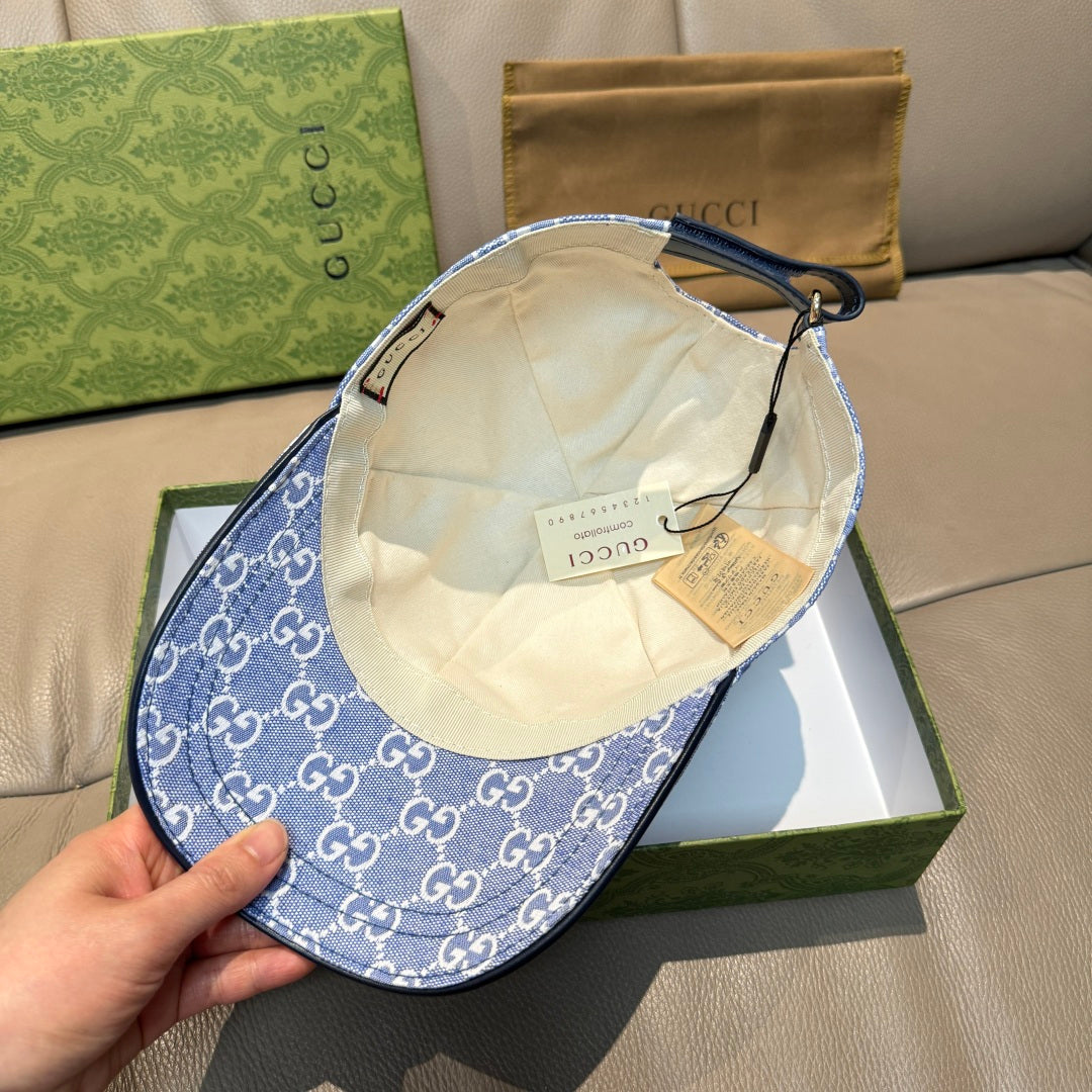 Gucci GG canvas baseball cap with blue patterned exterior and light interior lining