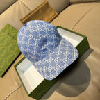 Gucci GG canvas baseball cap in blue with curved brim and black button top
