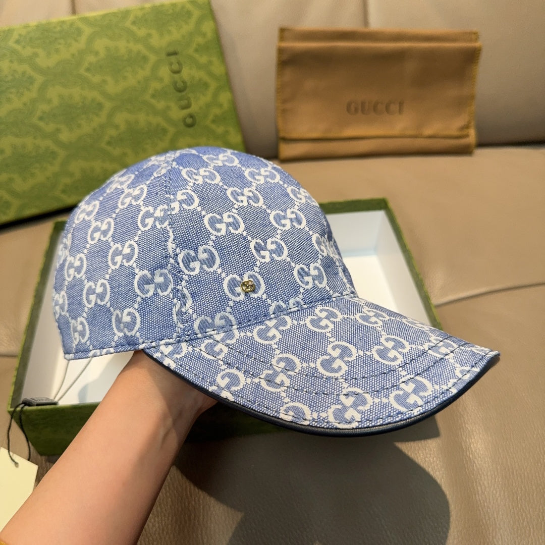 Gucci GG canvas baseball cap in blue with curved brim and front button, side view