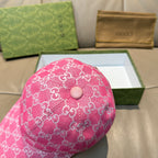 Pink GG-print baseball cap with front button detail on the crown.