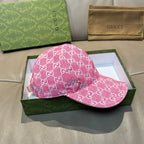 Pink GG-print baseball cap with curved brim and stitched crown panels.