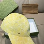 Gucci cap yellow with white GG monogram, side view of curved brim