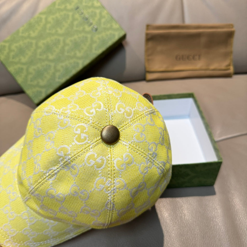Gucci cap yellow with white GG monogram and round metal button on top