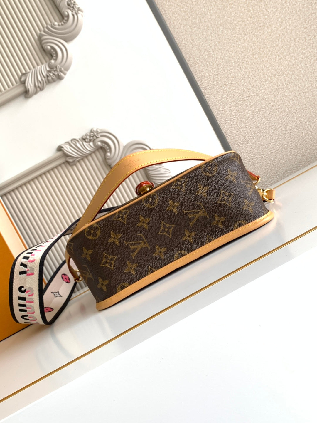 Monogram canvas mini satchel with tan leather strap and gold-tone hardware