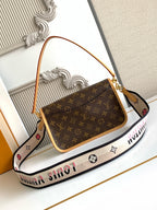 Monogram canvas shoulder bag with tan top handle, front flap, and crossbody strap