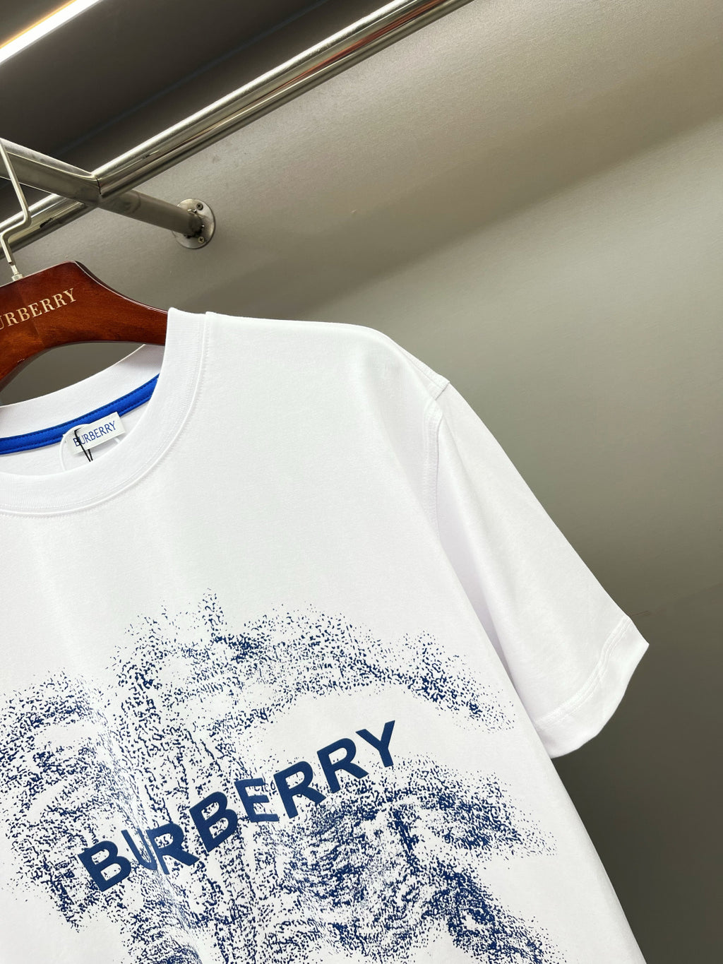 White short-sleeve T-shirt with blue textured Burberry logo print detail