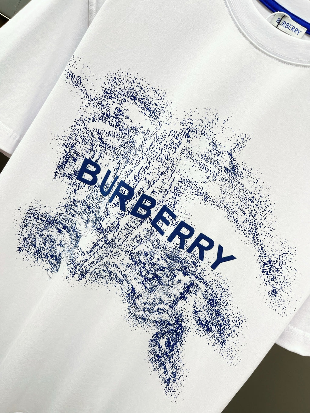 White T-shirt with large blue Burberry splash logo across chest