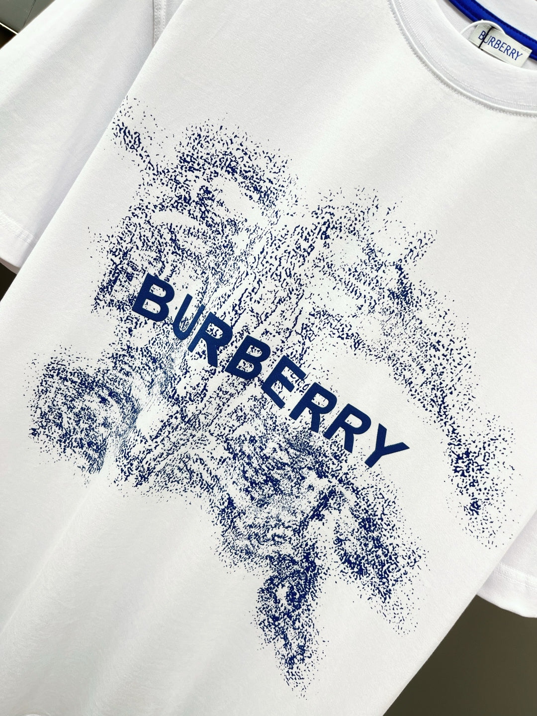 White T-shirt with large blue Burberry splash logo across chest