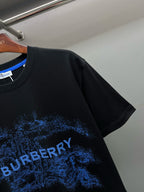 Black Burberry T-shirt with blue logo graphic text on sleeve