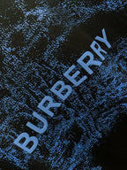 Blue Burberry logo text on black T-shirt