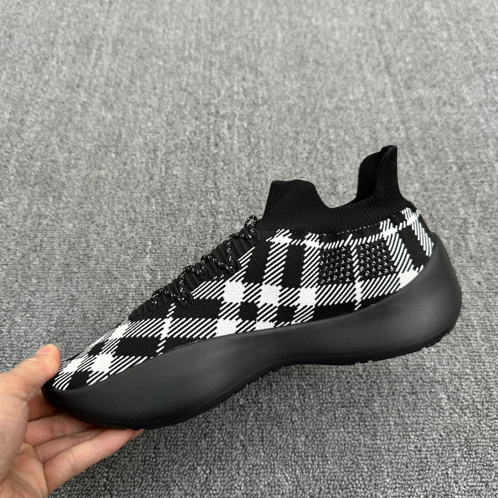Black and white check knit sneaker with black rubber midsole and lace-up front