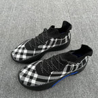 Burberry check knit sneakers with black sock collar and textured black rubber sole