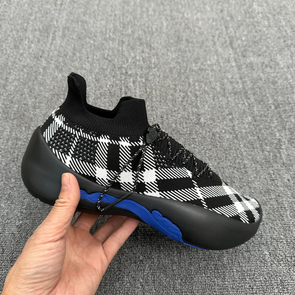 Black and white check knit sneaker with slip-on style collar and blue sole stripe