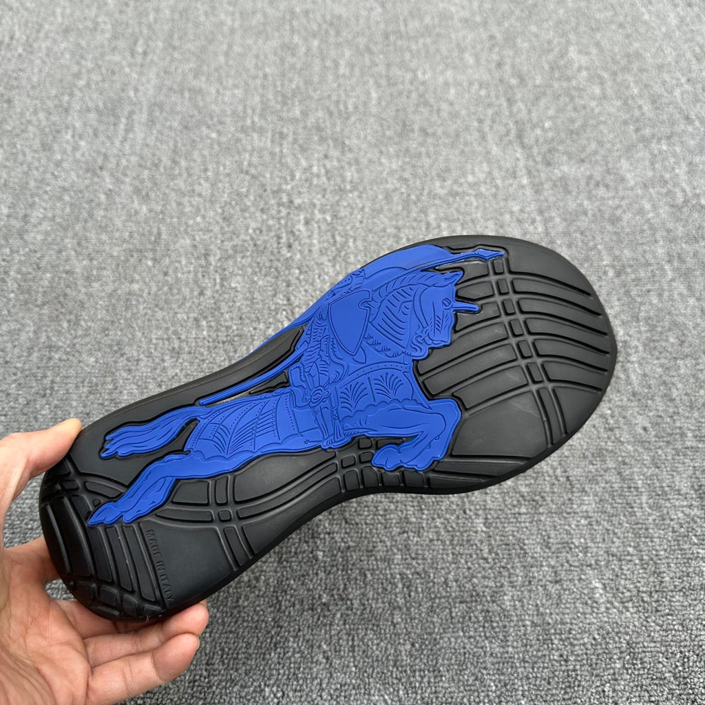 Burberry sneaker outsole with blue horse emblem and black rubber tread