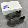 Pair of plaid knit sneakers with blue sole accents and lace-up design
