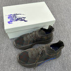 Pair of plaid knit sneakers with blue sole accents and lace-up design