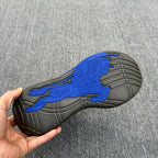 Sneaker outsole with blue panther grip detail and rubber tread pattern