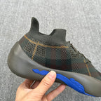 Plaid knit sneaker with blue side sole stripe and cushioned rubber outsole