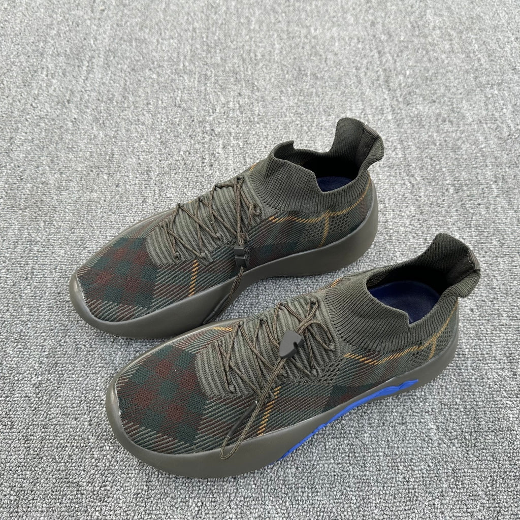 Pair of lace-up plaid knit sneakers with navy lining and blue side stripe