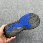 Sneaker outsole with blue horse graphic and molded gray tread