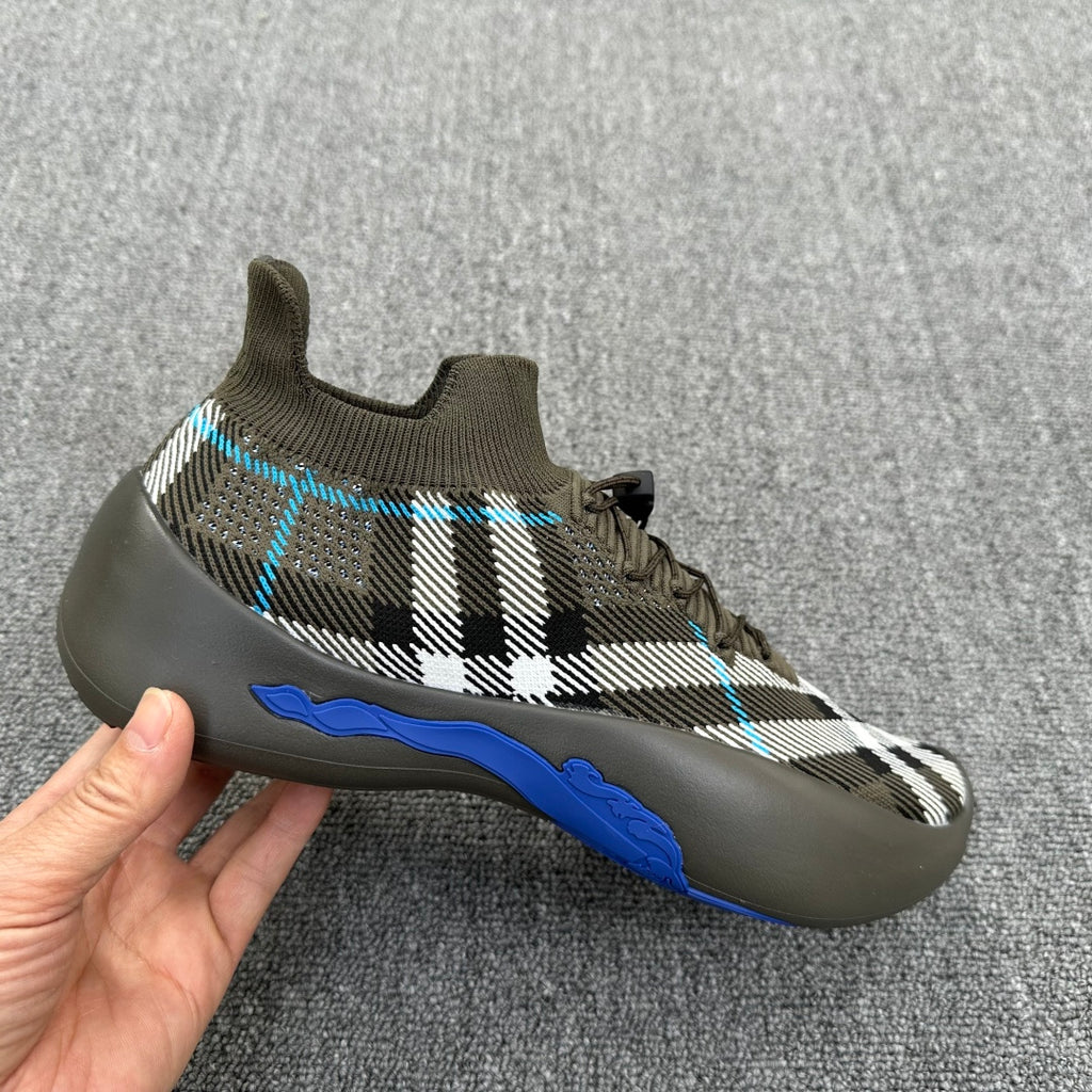 Single lace-up sneaker in olive with black-and-white plaid knit, blue sole detail