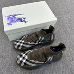 Pair of sneakers in olive with black-and-white plaid and blue trim