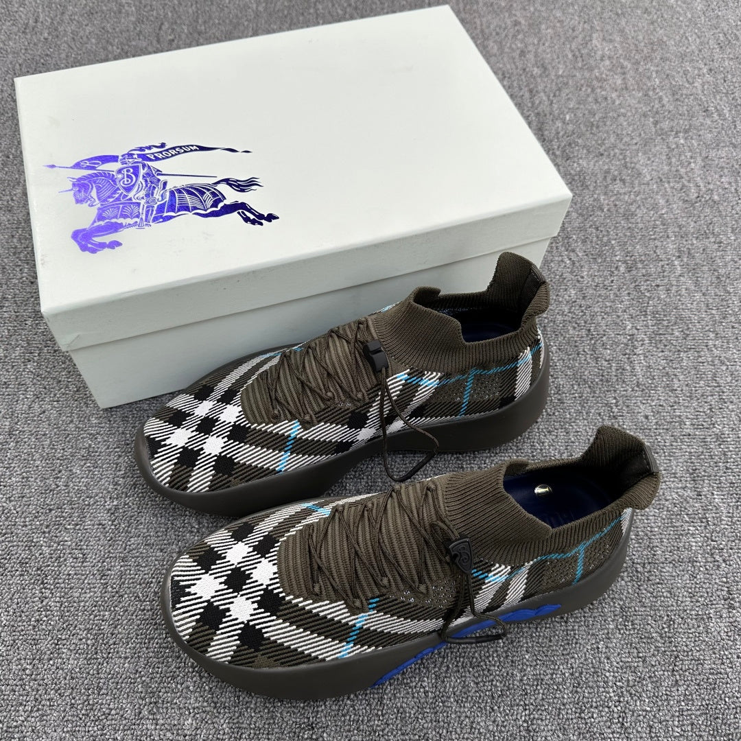 Pair of sneakers in olive with black-and-white plaid and blue trim