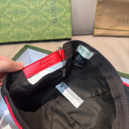 Gucci baseball cap interior lining in dark fabric with hanging tag and inner label.