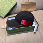 Gucci dark navy baseball cap with red front logo band and curved brim