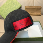 Gucci dark navy baseball cap close-up with red GG logo panel