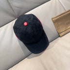 Gucci dark navy baseball cap with GG pattern and red top button