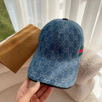 Blue monogram baseball cap with curved brim and multicolor Gucci web stripe.