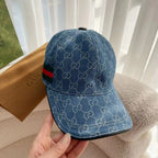 Blue monogram baseball cap, back view, with green and red stripe across the band.