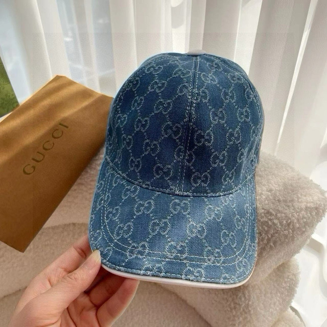 Blue Gucci monogram baseball cap with curved brim and back seam