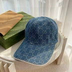 Blue Gucci monogram baseball cap with curved brim and stitched panels