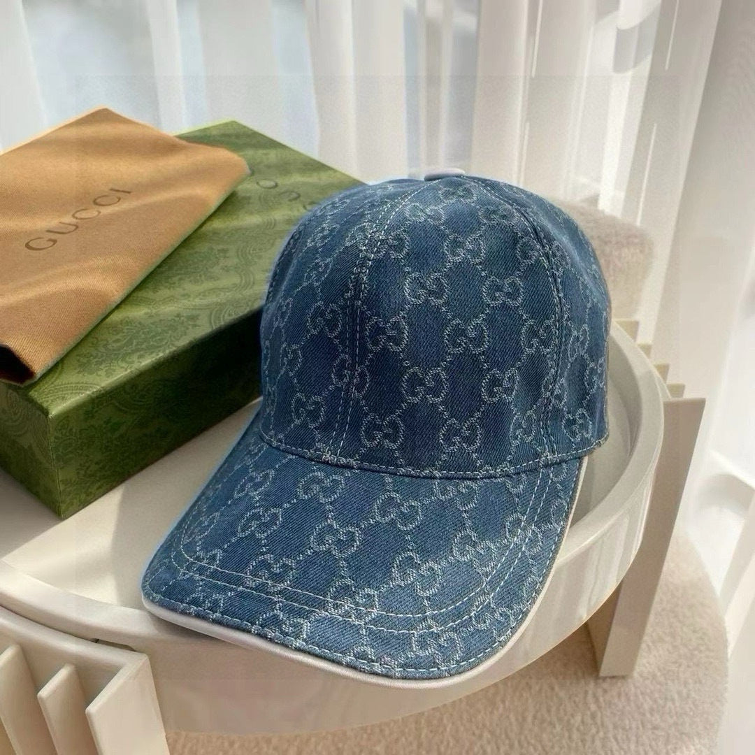 Blue Gucci monogram baseball cap with curved brim and stitched panels